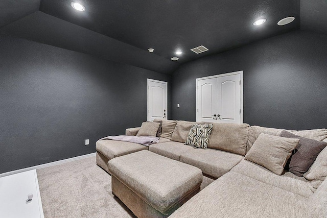 carpeted cinema featuring visible vents, recessed lighting, baseboards, and lofted ceiling