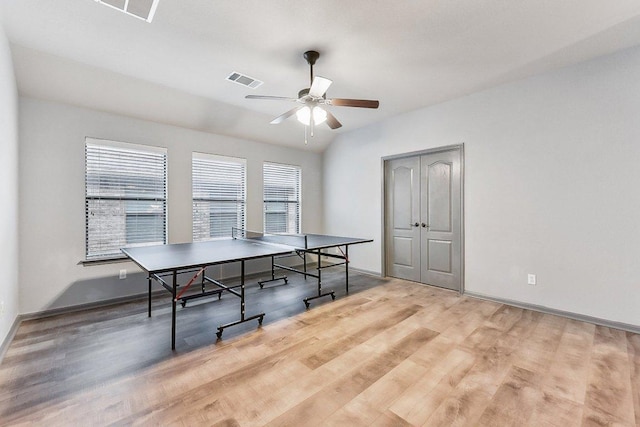 rec room with baseboards, ceiling fan, visible vents, and wood finished floors