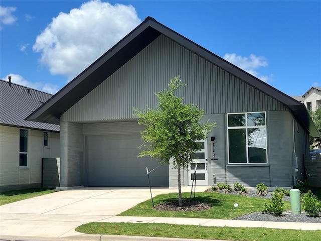 view of front of property featuring an attached garage and driveway