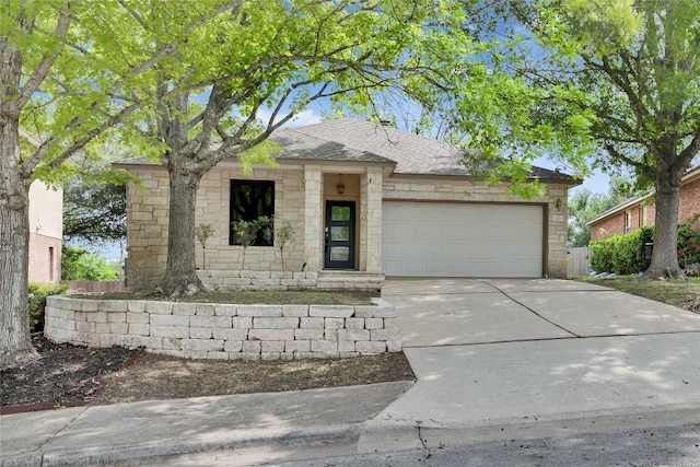 2720 Cascade Falls Dr, Austin, TX 78738 - view of front facade featuring an attached garage, stone siding, concrete driveway, and a shingled roof