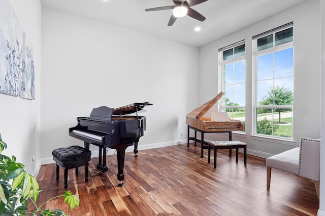 sitting room with a ceiling fan, baseboards, recessed lighting, and wood finished floors