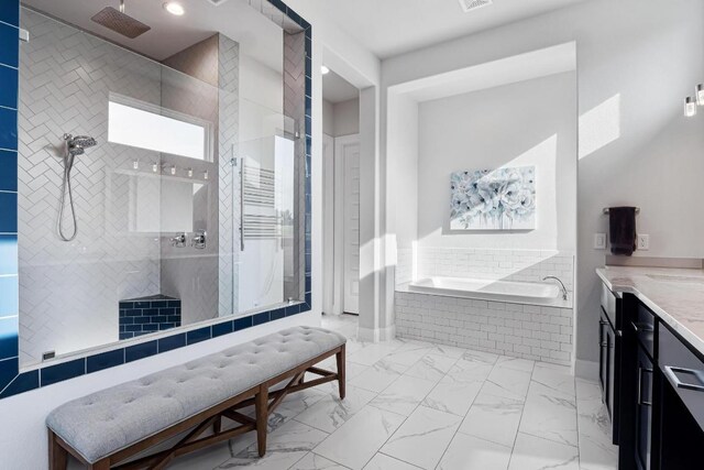 504 Loyal June Trl, Leander, TX 78641 - bathroom with a bath, vanity, a tile shower, and marble look tile flooring