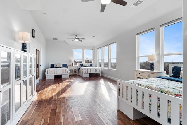 504 Loyal June Trl, Leander, TX 78641 - bedroom with dark wood-style flooring and a ceiling fan