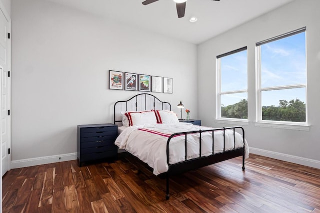 bedroom with baseboards, recessed lighting, and wood finished floors