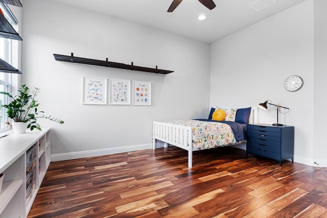 bedroom featuring baseboards, recessed lighting, wood finished floors, and visible vents
