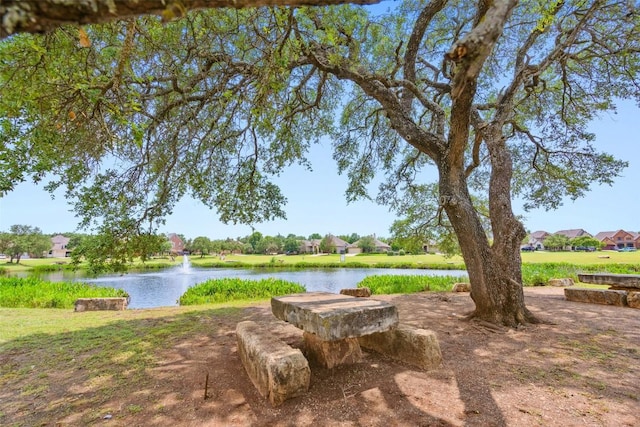 view of home's community featuring a water view and a residential view