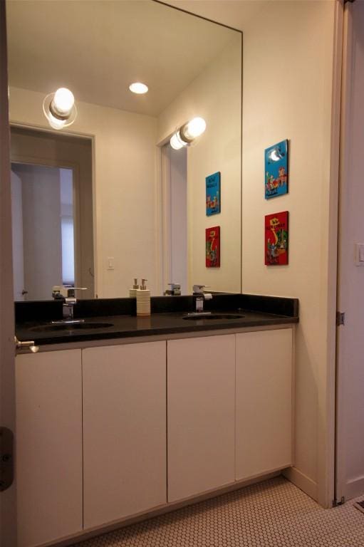 bathroom with double vanity and a sink