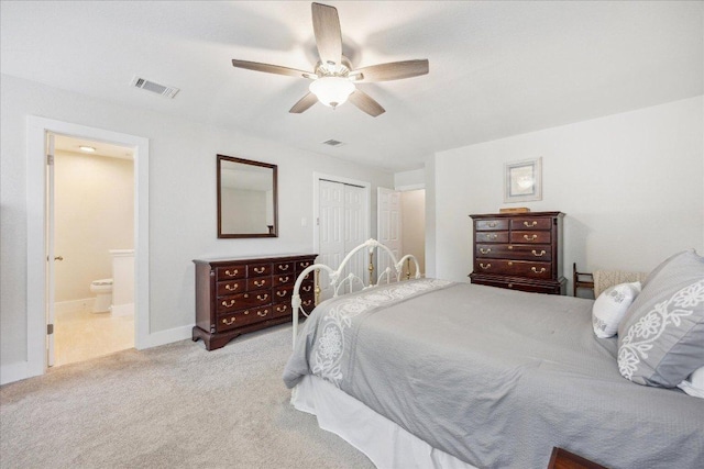 706 Wagon Wheel Trl, Pflugerville, TX 78660 - bedroom with carpet floors, a closet, ensuite bathroom, a ceiling fan, and baseboards