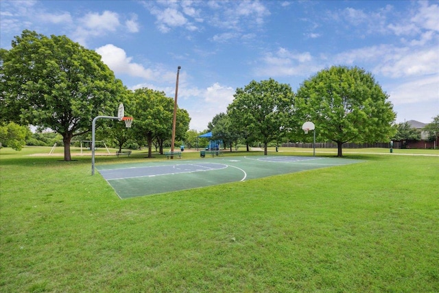 view of sport court featuring a lawn and community basketball court