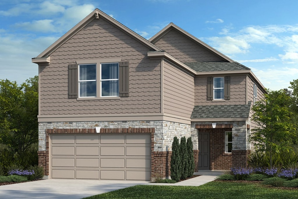 craftsman house with an attached garage, driveway, and stone siding