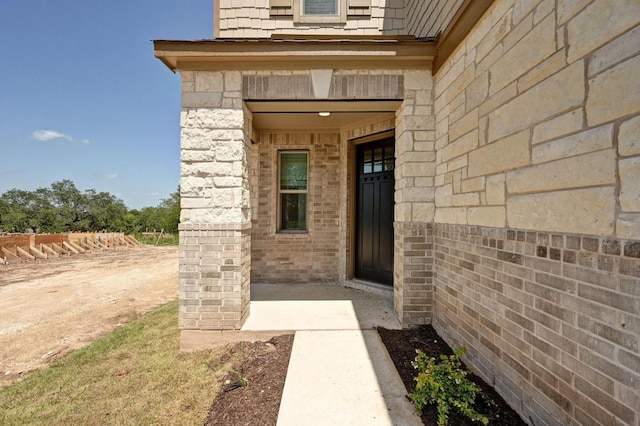 12126 Cantabria Rd, Austin, TX 78748 - property entrance featuring stone siding and brick siding