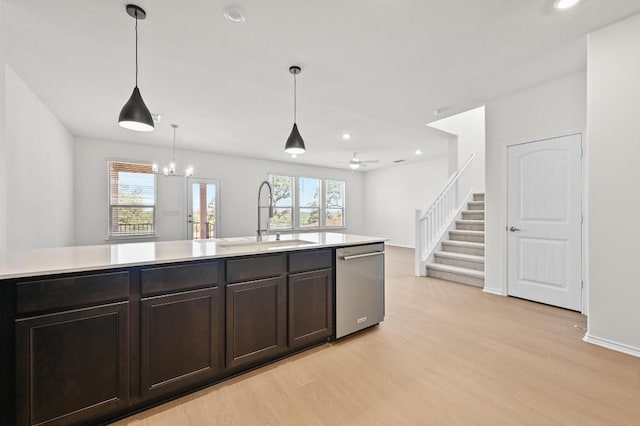 12126 Cantabria Rd, Austin, TX 78748 - kitchen featuring dishwasher, light countertops, light wood-style floors, healthy amount of natural light, and recessed lighting