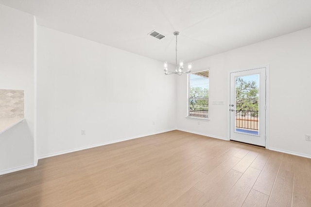 12126 Cantabria Rd, Austin, TX 78748 - unfurnished dining area featuring a chandelier and wood finished floors