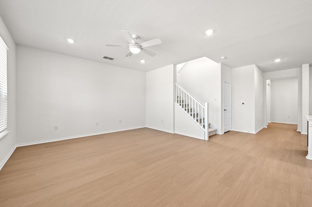 12126 Cantabria Rd, Austin, TX 78748 - empty room with stairway, a ceiling fan, light wood-style floors, recessed lighting, and plenty of natural light