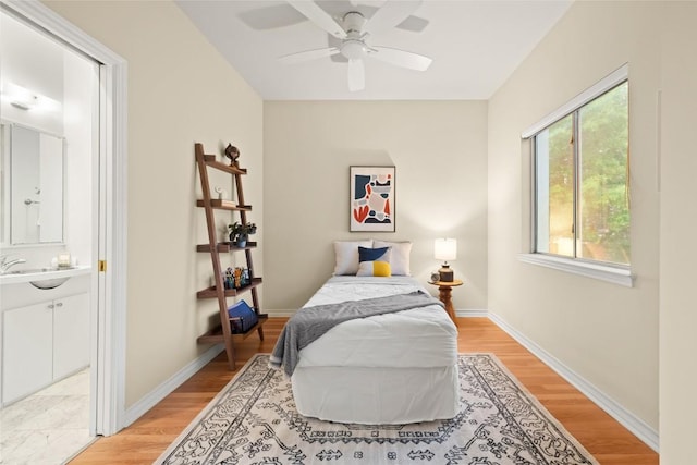 5926 N W Pl, Austin, TX 78731 - bedroom with light wood-style floors, baseboards, and ceiling fan
