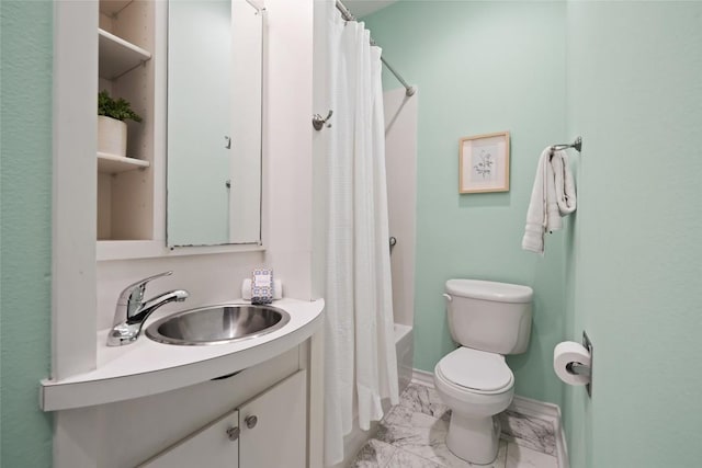 full bath featuring vanity, marble finish floor, toilet, baseboards, and shower / bath combo