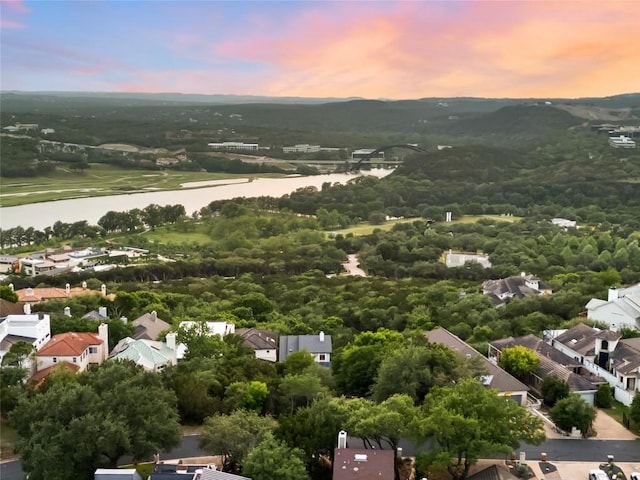 drone / aerial view featuring a residential view and a water and mountain view