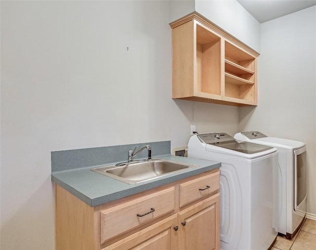 3606 Bunyan Cir, Lago Vista, TX 78645 - laundry room with washing machine and clothes dryer, cabinet space, and light tile patterned floors