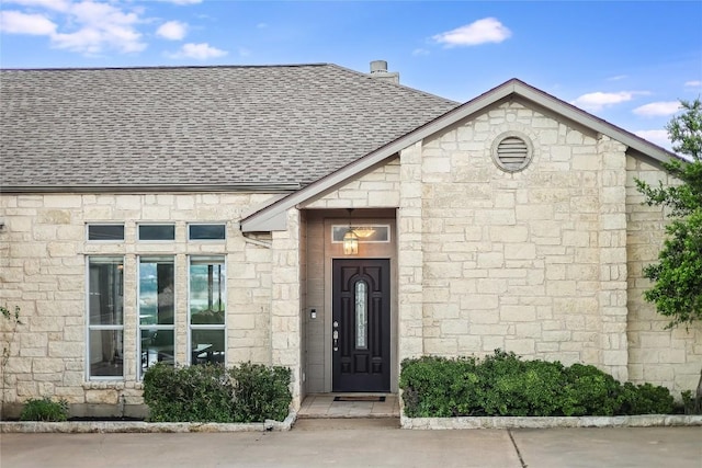 3606 Bunyan Cir, Lago Vista, TX 78645 - property entrance featuring roof with shingles and stone siding
