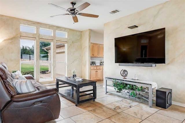 3606 Bunyan Cir, Lago Vista, TX 78645 - living area featuring a ceiling fan and light tile patterned flooring