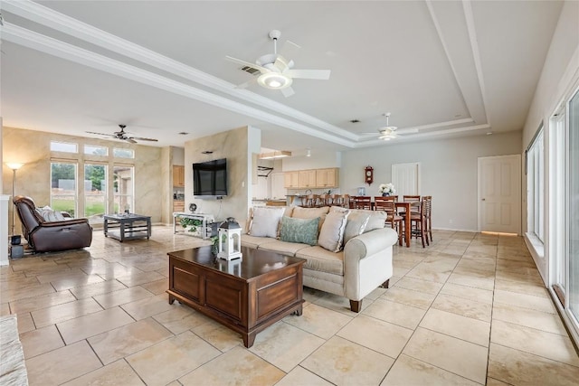 3606 Bunyan Cir, Lago Vista, TX 78645 - living area with ceiling fan, a raised ceiling, and light tile patterned floors