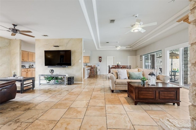3606 Bunyan Cir, Lago Vista, TX 78645 - living area with ceiling fan, a tray ceiling, and light tile patterned floors