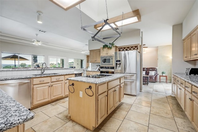 3606 Bunyan Cir, Lago Vista, TX 78645 - kitchen with black appliances, a sink, ceiling fan, and light brown cabinets