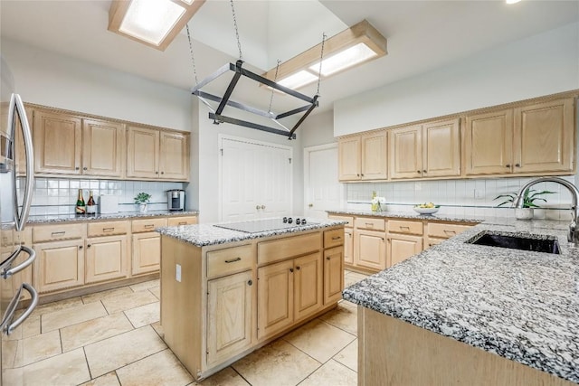 3606 Bunyan Cir, Lago Vista, TX 78645 - kitchen featuring light brown cabinets, backsplash, freestanding refrigerator, and high vaulted ceiling