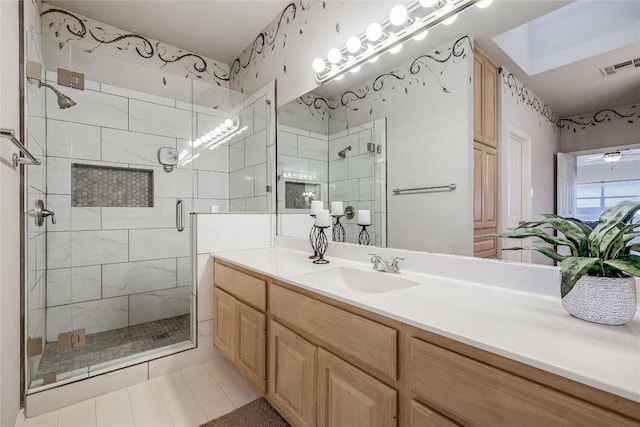 3606 Bunyan Cir, Lago Vista, TX 78645 - bathroom featuring a stall shower, vanity, and tile patterned floors