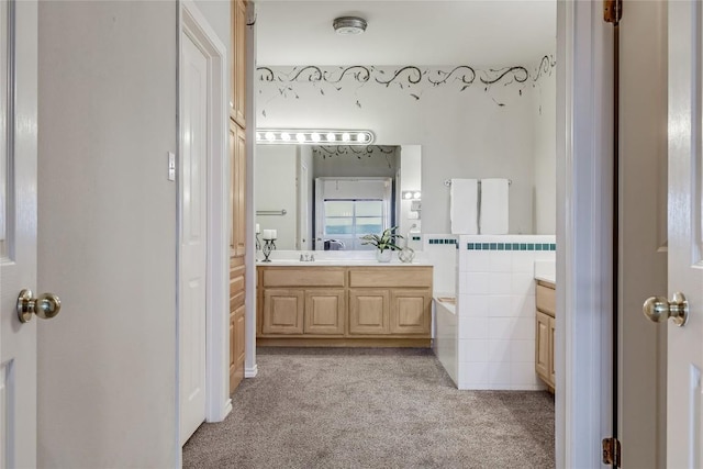 3606 Bunyan Cir, Lago Vista, TX 78645 - full bathroom featuring vanity, a bath, tile walls, and carpet