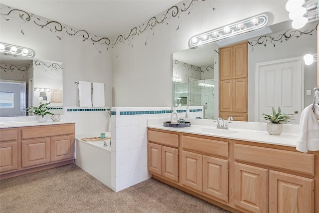 3606 Bunyan Cir, Lago Vista, TX 78645 - full bathroom with vanity, a stall shower, a bath, tile walls, and carpet floors