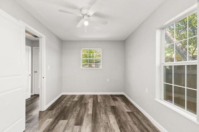 unfurnished bedroom with dark wood-style flooring, baseboards, and ceiling fan