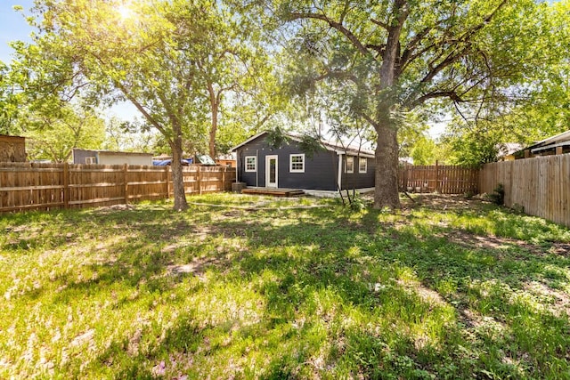 view of yard with a fenced backyard