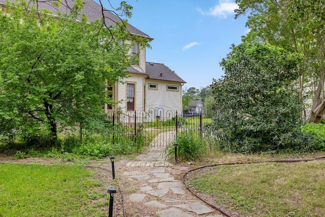 view of yard with fence and a gate