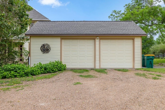 detached garage featuring driveway