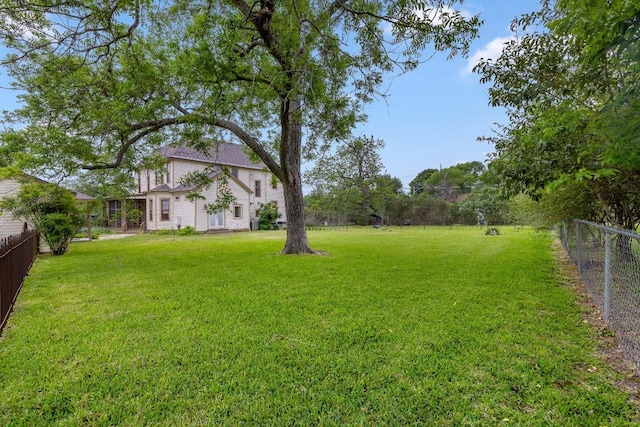 view of yard with a fenced backyard