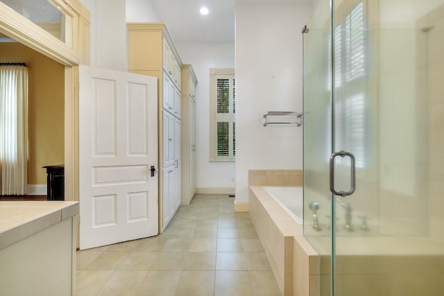 full bathroom with tile patterned flooring, vanity, recessed lighting, a garden tub, and a stall shower