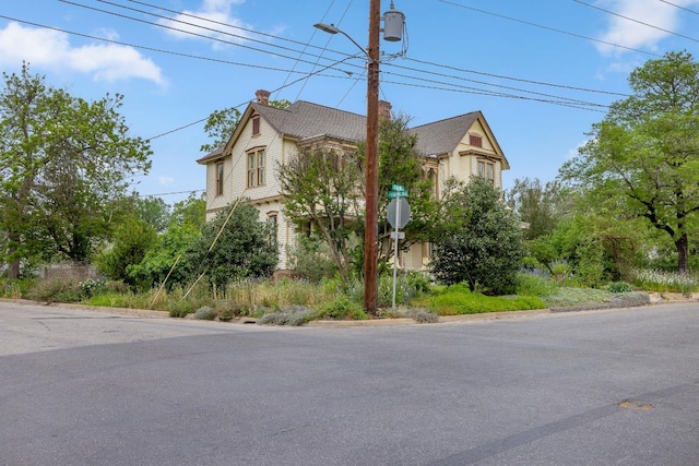 view of property exterior featuring a chimney