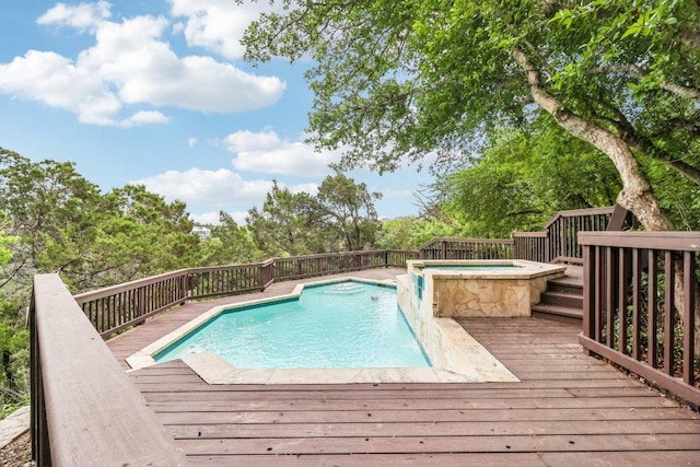 view of pool featuring a fenced in pool, an in ground hot tub, and a deck