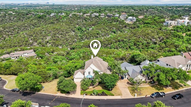 aerial view with a wooded view and a residential view