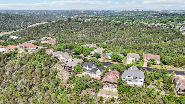 bird's eye view featuring a forest view and a residential view