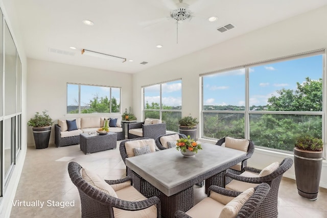 sunroom with visible vents, recessed lighting, and tile patterned floors