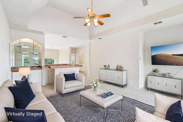 7100 Valburn Dr, Austin, TX 78731 - living area with ceiling fan and light colored carpet