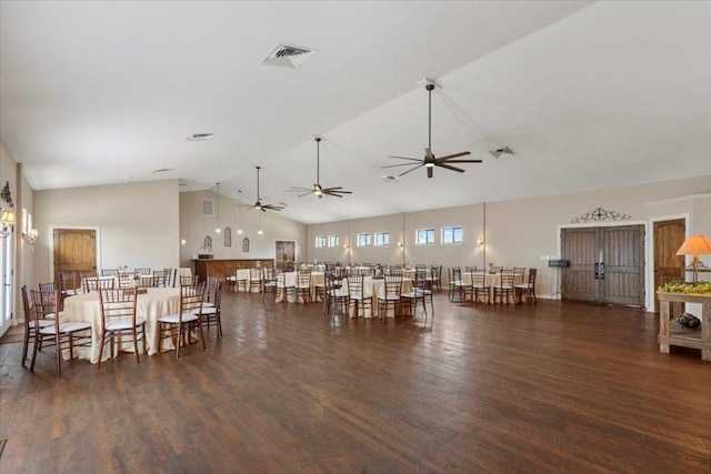 dining area featuring ceiling fan, high vaulted ceiling, visible vents, and wood finished floors