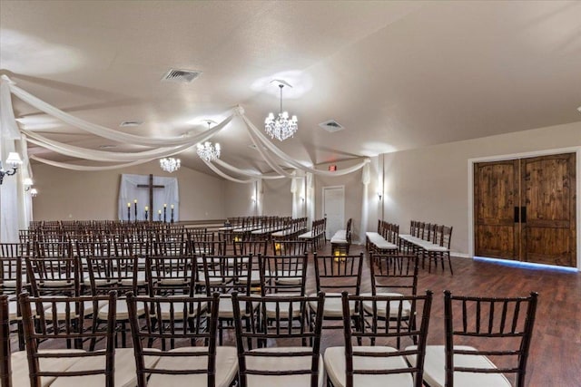 178 Pine Tree Loop, Bastrop, TX 78602 - dining space featuring a chandelier, wood finished floors, and lofted ceiling
