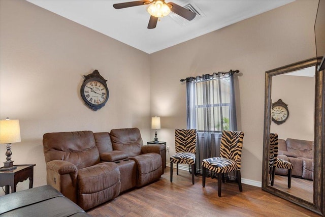 178 Pine Tree Loop, Bastrop, TX 78602 - living room featuring a ceiling fan and wood finished floors