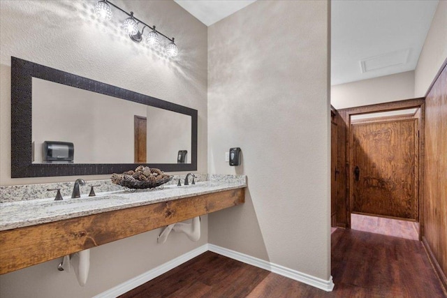 178 Pine Tree Loop, Bastrop, TX 78602 - bathroom featuring a sink and wood finished floors