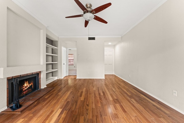 unfurnished living room featuring built in features, ceiling fan, baseboards, and wood finished floors