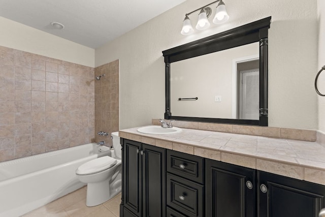 full bath with toilet, tile patterned floors, bathing tub / shower combination, and vanity