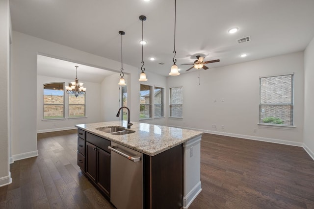 kitchen with visible vents, stainless steel dishwasher, a sink, baseboards, and open floor plan